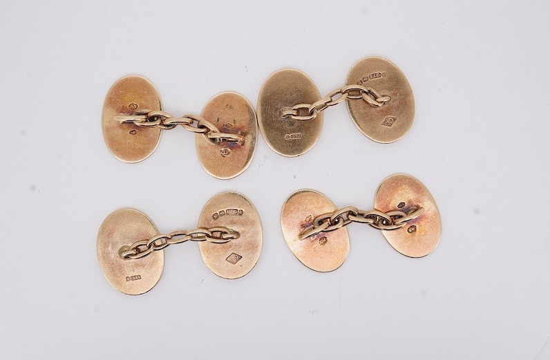 A pair of early to mid 20th century Austro Hungarian yellow metal and two colour enamel set oval cufflinks and a pair of 1930's engine turned 9ct gold oval cufflinks, gross weight 22 grams. Condition - fair